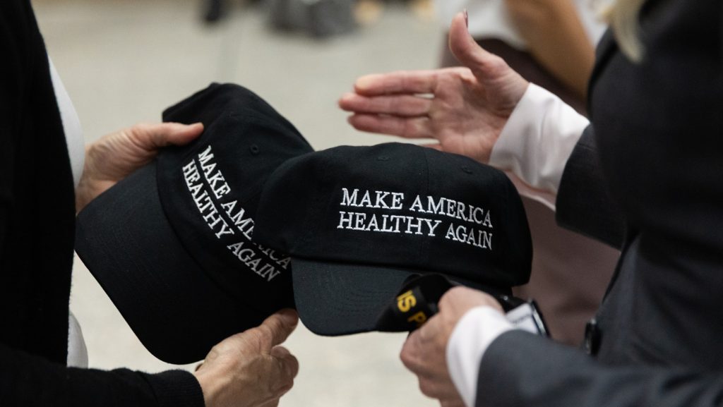 Make America Healthy Again hats are given out at a news conference on removing synthetic dyes from America's food supply, at the Health and Human Services Headquarters in Washington, DC on 22 April 2025