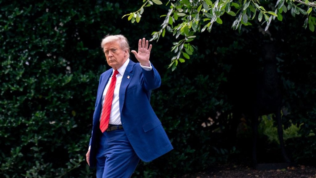 US President Donald Trump walks on the South Lawn of the White House before boarding Marine One in Washington, DC, US, on 20 June 2025