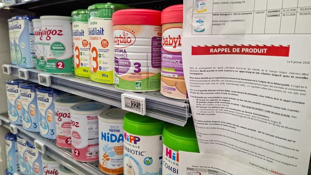 Infant formula brands on display in Paris, France, on 10 February 2026 next to a product recall notice for batches of Guigoz products. Guigoz is a Nestlé brand. Credit: Riccardo Milani/Hans Lucas/AFP via Getty Images